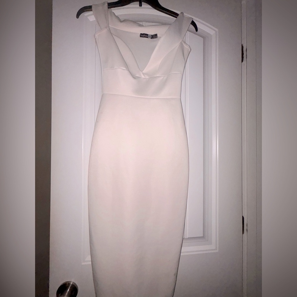 White bodycon Boohoo dress with slight V-neck.